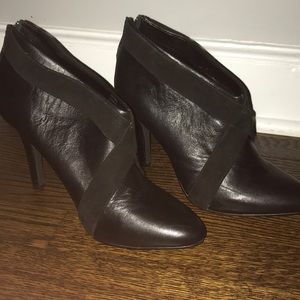 Black Calvin Klein booties with fabric detail